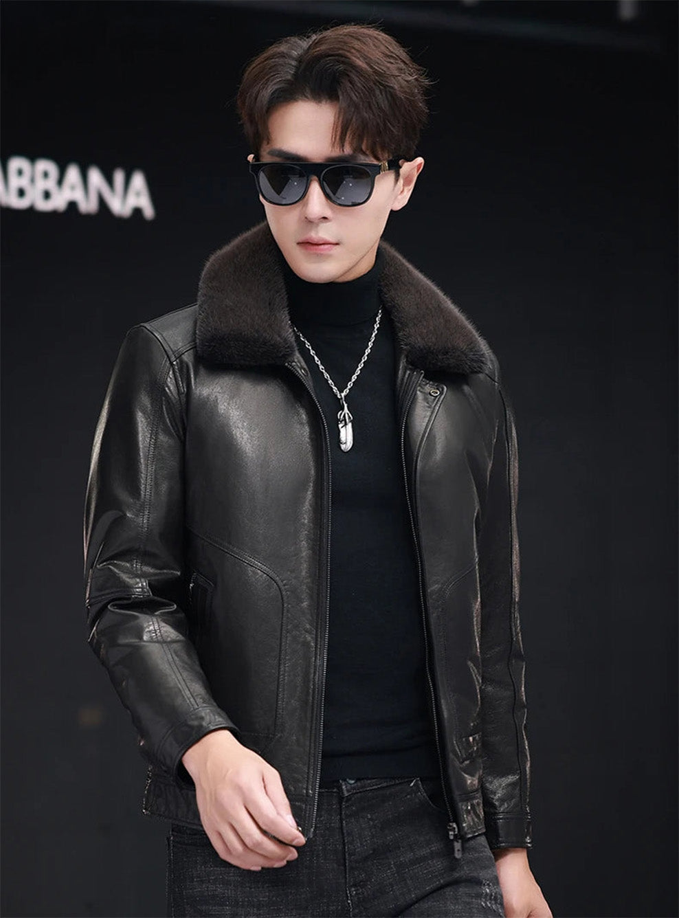 Side glance of man walking in goatskin jacket with mink collar in Onyx — From Borcelleclothes.