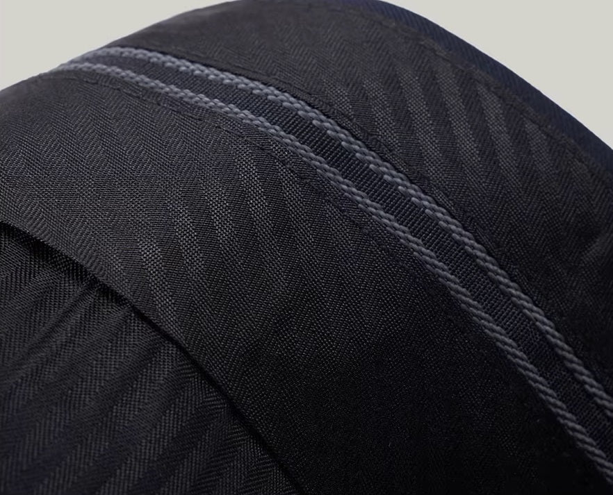 The gripper tape inside the waistband of the pants from the Borcelleclothes Men's Modern Gentleman’s Ebony Clay Suit, designed to keep shirts securely tucked.