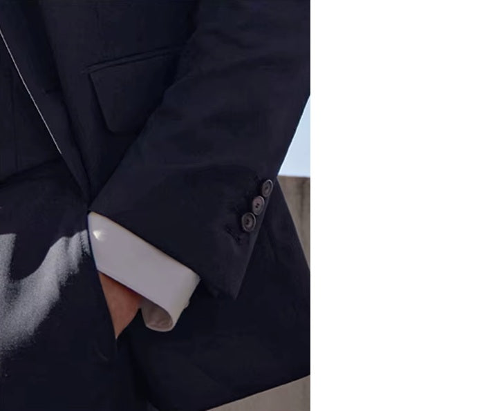 Close-up of the Borcelleclothes Men's Modern Gentleman’s Ebony Clay Suit, featuring the model’s hand in the pants pocket, highlighting the fabric texture and tailored details