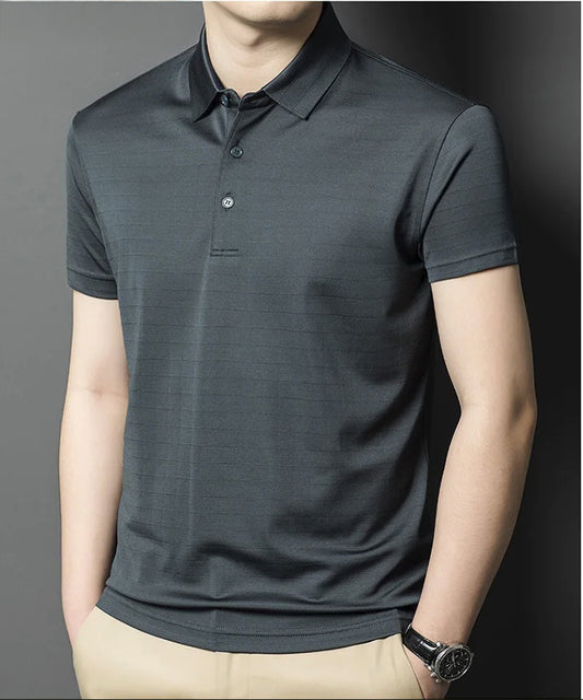 Frontal view of model in Fiord polo — poised in silk with quiet grid. From Borcelleclothes.