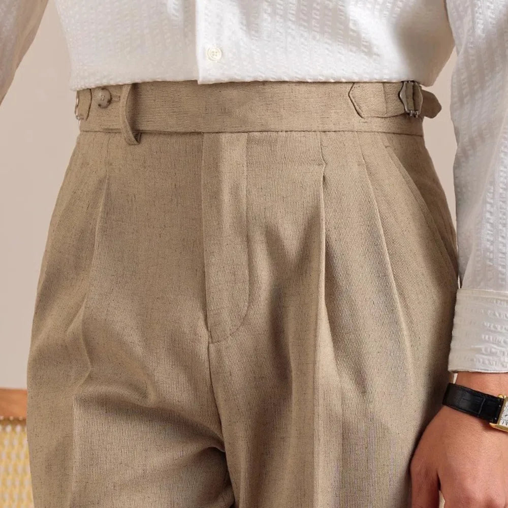 Men’s cropped trousers in Sandrift — featuring side adjusters, clean front, and cuffed hem. A structured silhouette without the need for a belt. From Borcelleclothes.