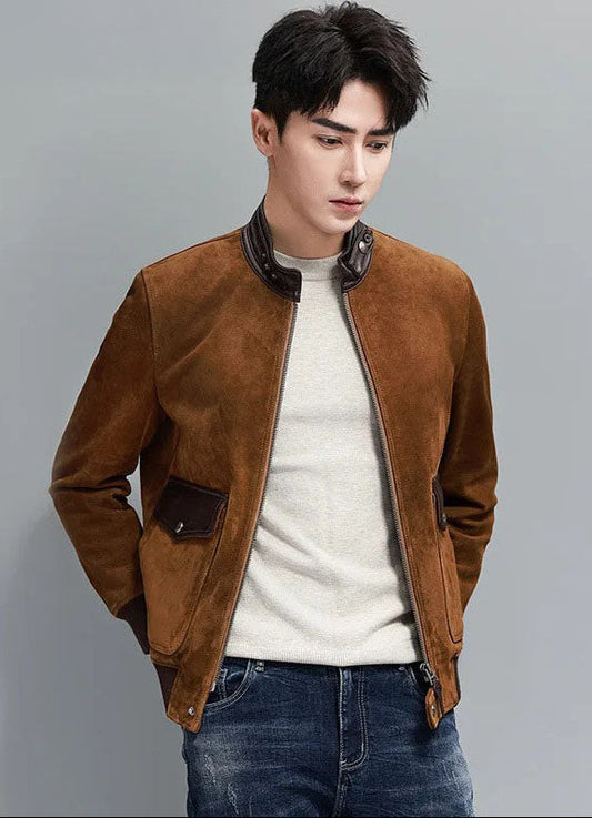 Nutmeg Suede Bomber — model with hands behind back; sheepskin suede, smooth-leather stand collar, rib cuffs and hem. From Borcelleclothes.