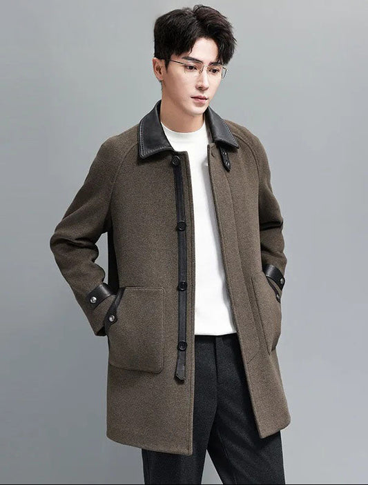 Makara color men’s coat – model with hands in coat pockets. From Borcelleclothes.
