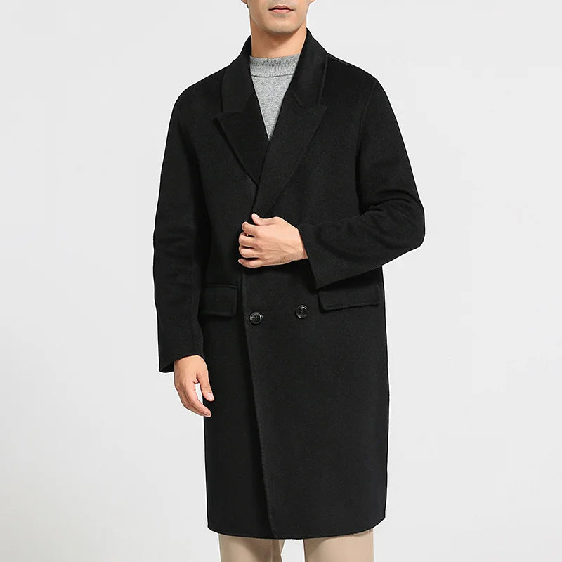 Men’s double-breasted wool coat with peaked lapels in Onyx—crafted for silence, weight, and enduring presence. From Borcelleclothes.