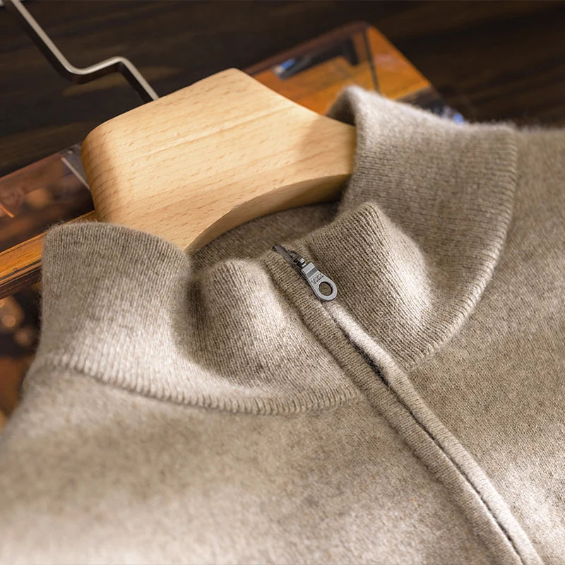 Close view of the collar on the men’s Sandrift plain stitch cashmere sweater, featuring a soft rib-knit mock neck with a short zipper — From Borcelleclothes.