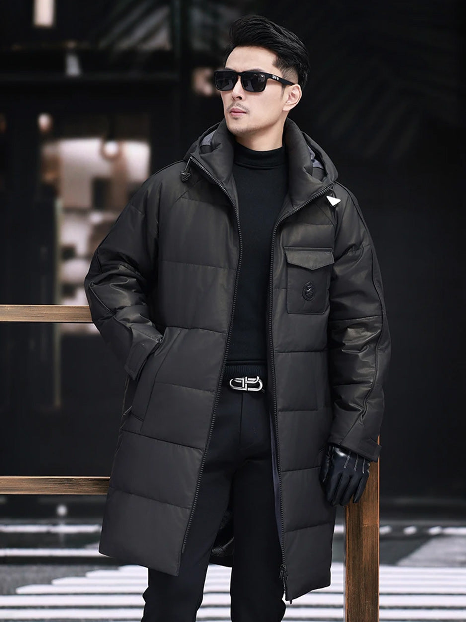 Model resting hand in pocket of the men’s cowhide down coat with raglan sleeves — From Borcelleclothes.