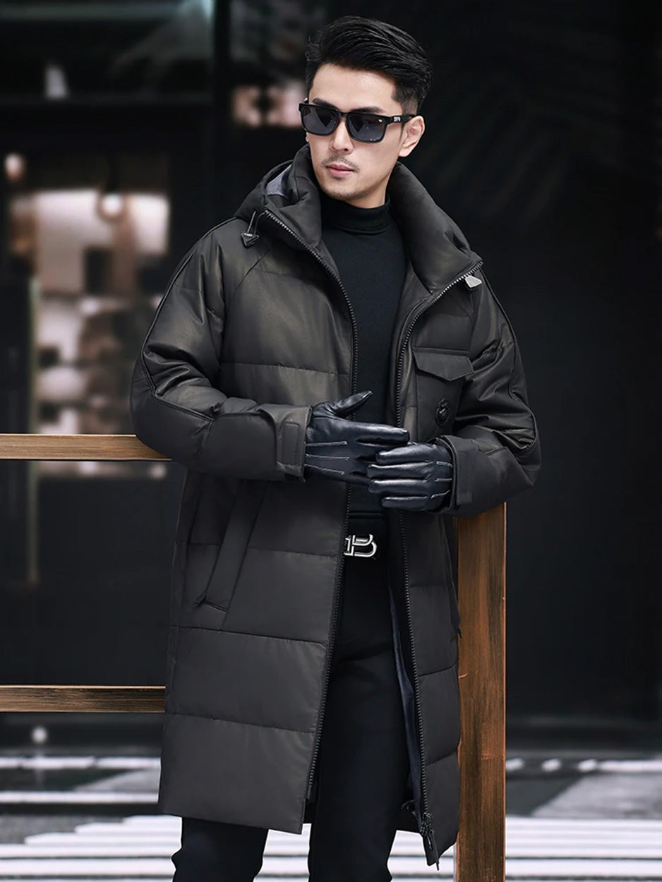 Model in Onyx cowhide down coat touching fingertips in gloves — From Borcelleclothes.