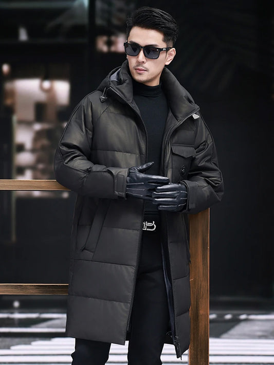Model in Onyx cowhide down coat touching fingertips in gloves — From Borcelleclothes.