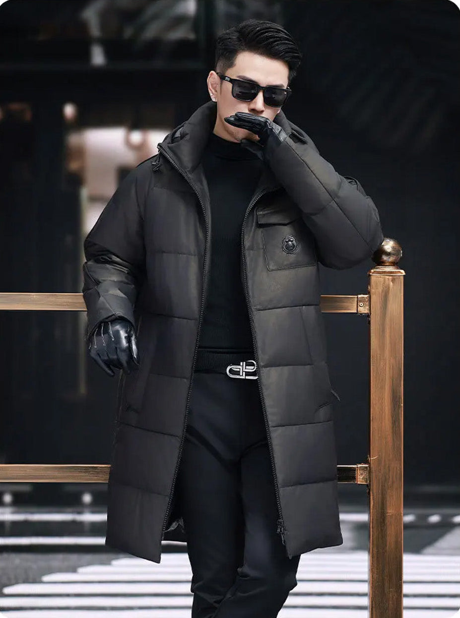 Model gently touching lips while wearing the Onyx cowhide down coat — From Borcelleclothes.