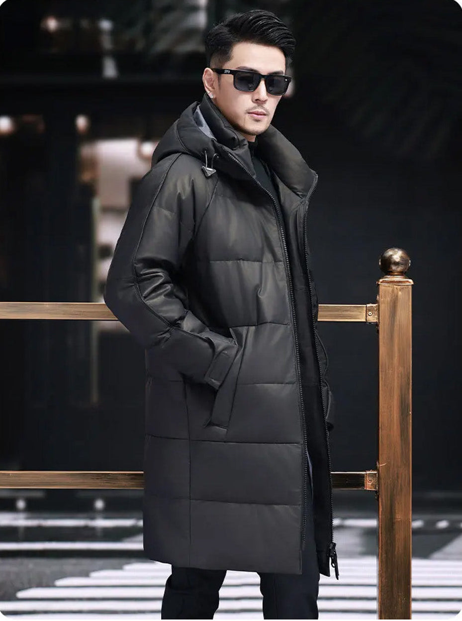 Model walking in profile in the men’s raglan-sleeved cowhide down coat — From Borcelleclothes.