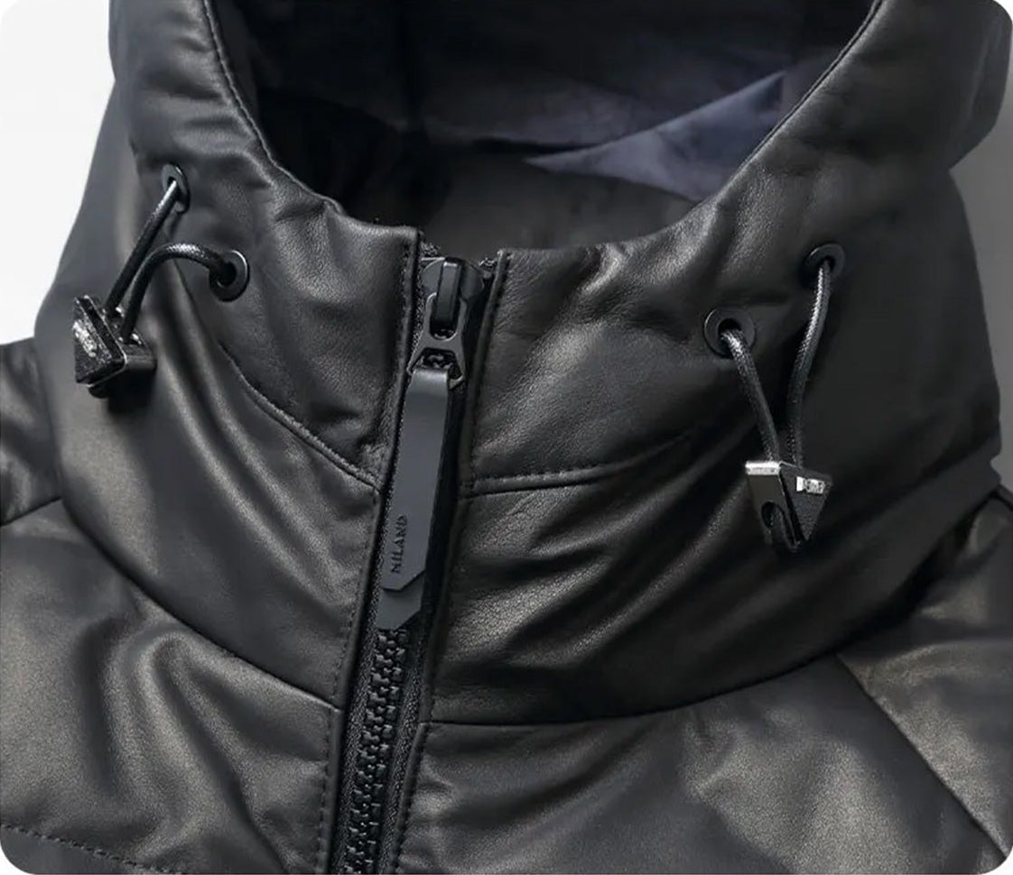 Zipped hood and sculptural collar of the men’s cowhide down coat in Onyx — From Borcelleclothes.