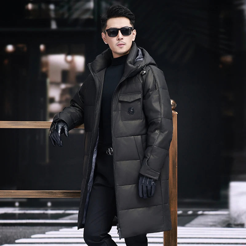 Men’s cowhide down coat in Onyx color, with raglan sleeves and sculpted hood-collar design. From Borcelleclothes.