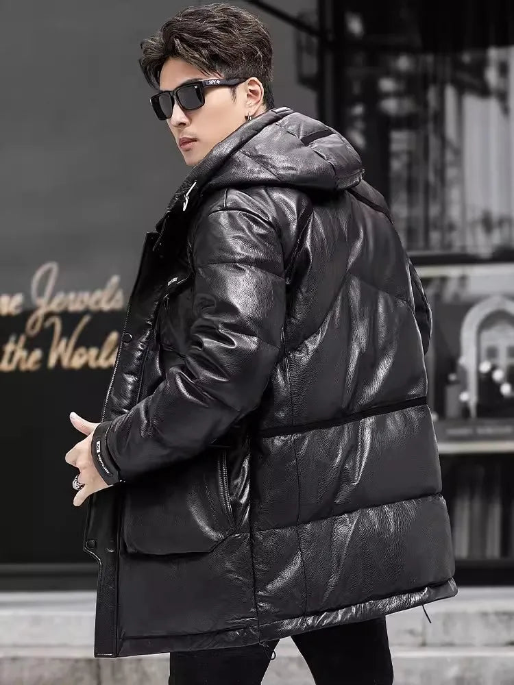 Back view of model in Onyx high-gloss down jacket, showing decorative ribbons and volume of the hood. From Borcelleclothes.