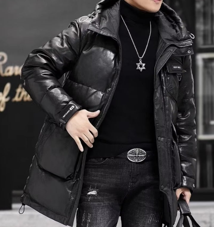 Model in gloss down jacket lightly touching front side, drawing attention to the zipper and shiny surface of the sheepskin. From Borcelleclothes.