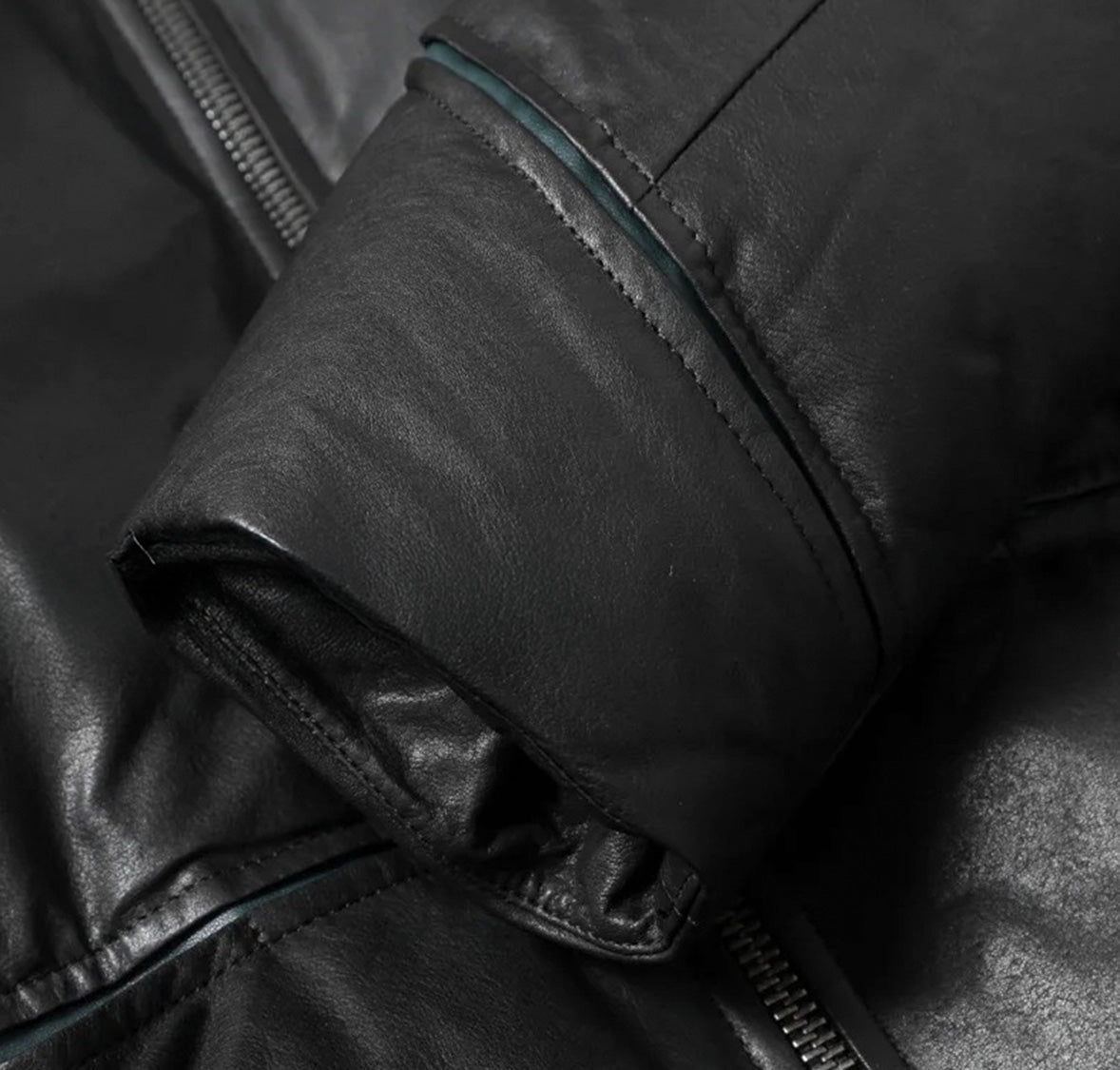 Close-up of sleeve paneling and sculpted cuff seam on Black Magic jacket — From Borcelleclothes.