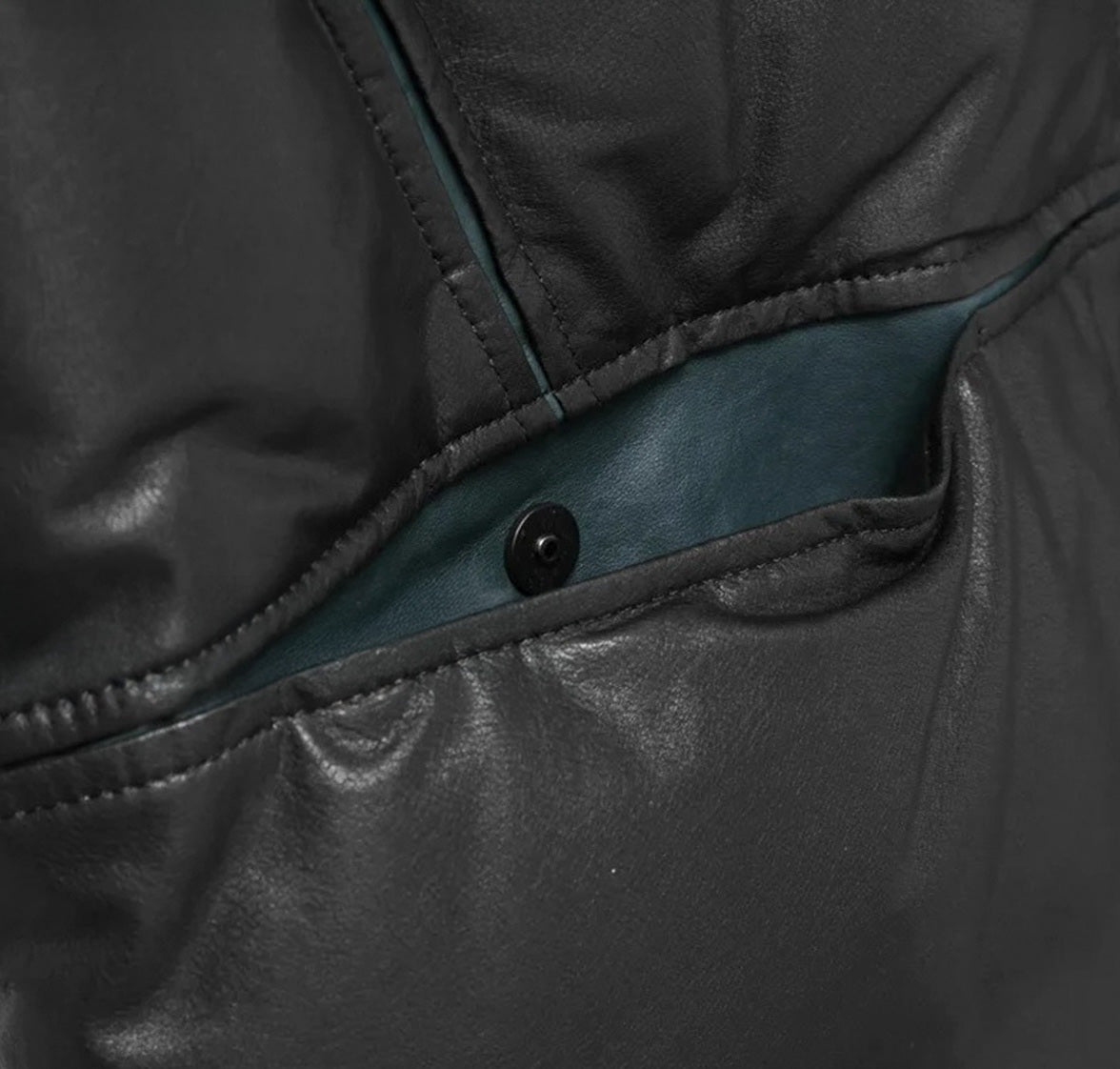 Unfastened waist pocket with contrast interior revealed beneath curved seam — From Borcelleclothes.