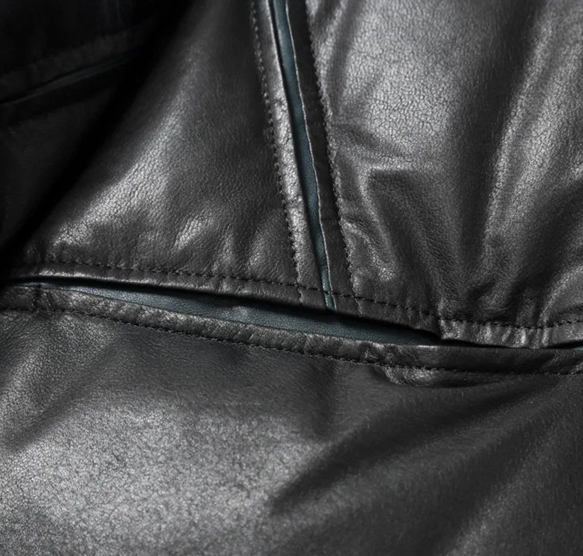 Detail of waist pocket integrated into sculpted seam with visible contrast underlayer — From Borcelleclothes.