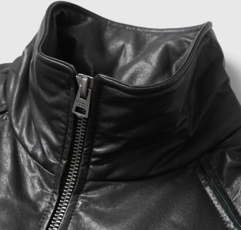 Detail of two-way zip closure extending into stand collar on Black Magic jacket — From Borcelleclothes.