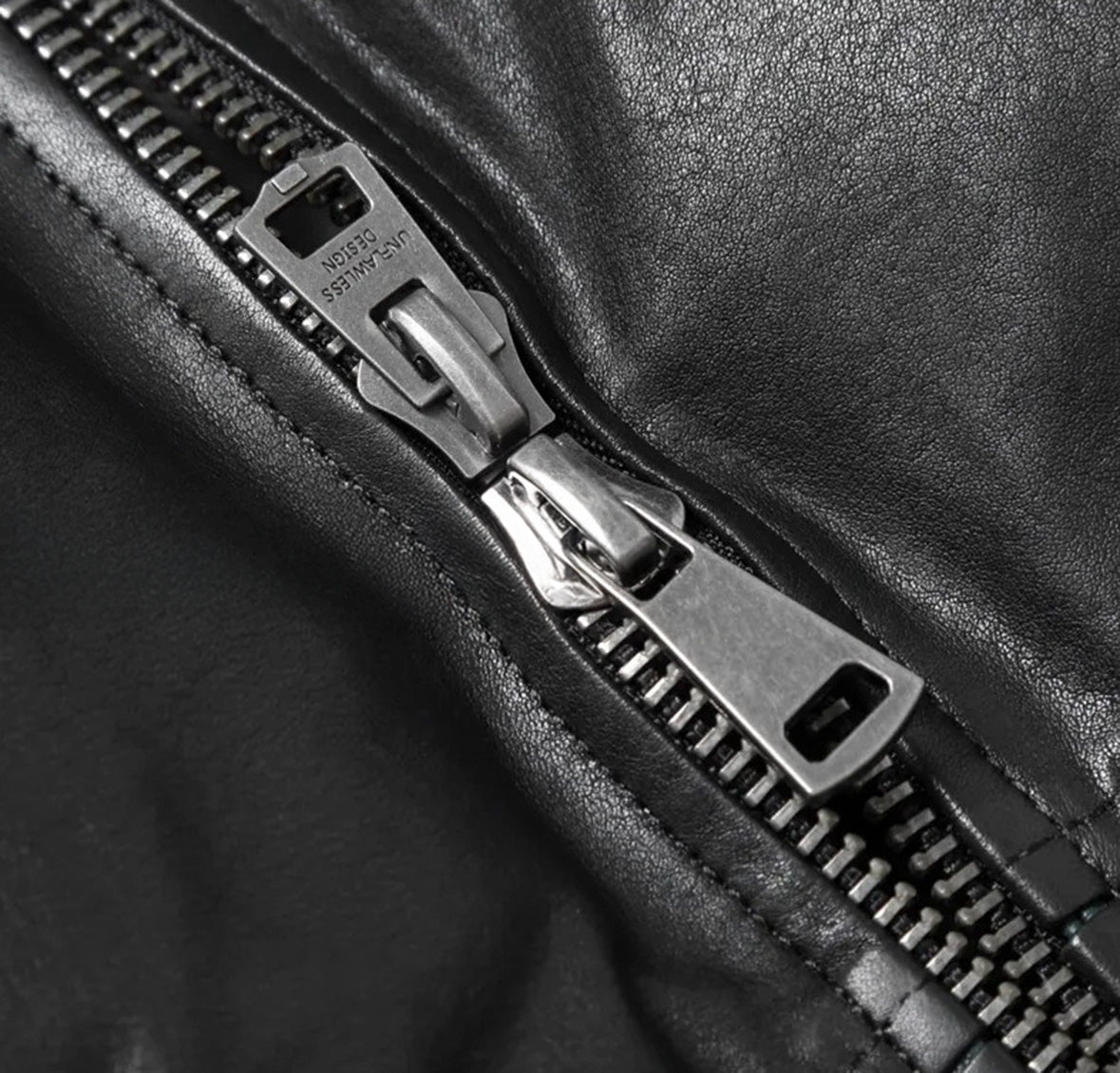 Two zipper pullers aligned at center front on Black Magic sheepskin down jacket — From Borcelleclothes.