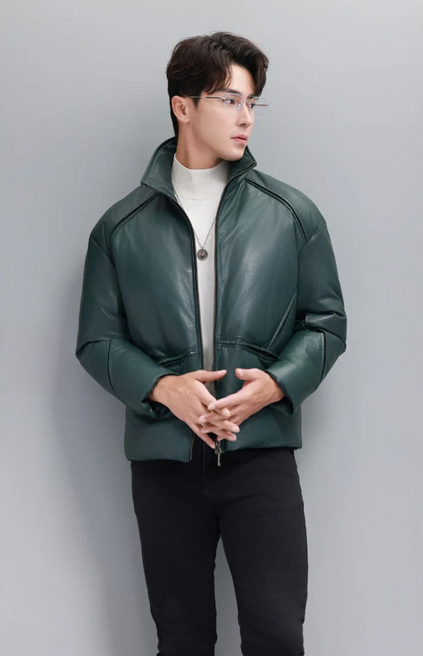 Model wearing Winter Balsam sheepskin down jacket with sculpted seams and contrast underlayers, hands gently crossed — From Borcelleclothes.