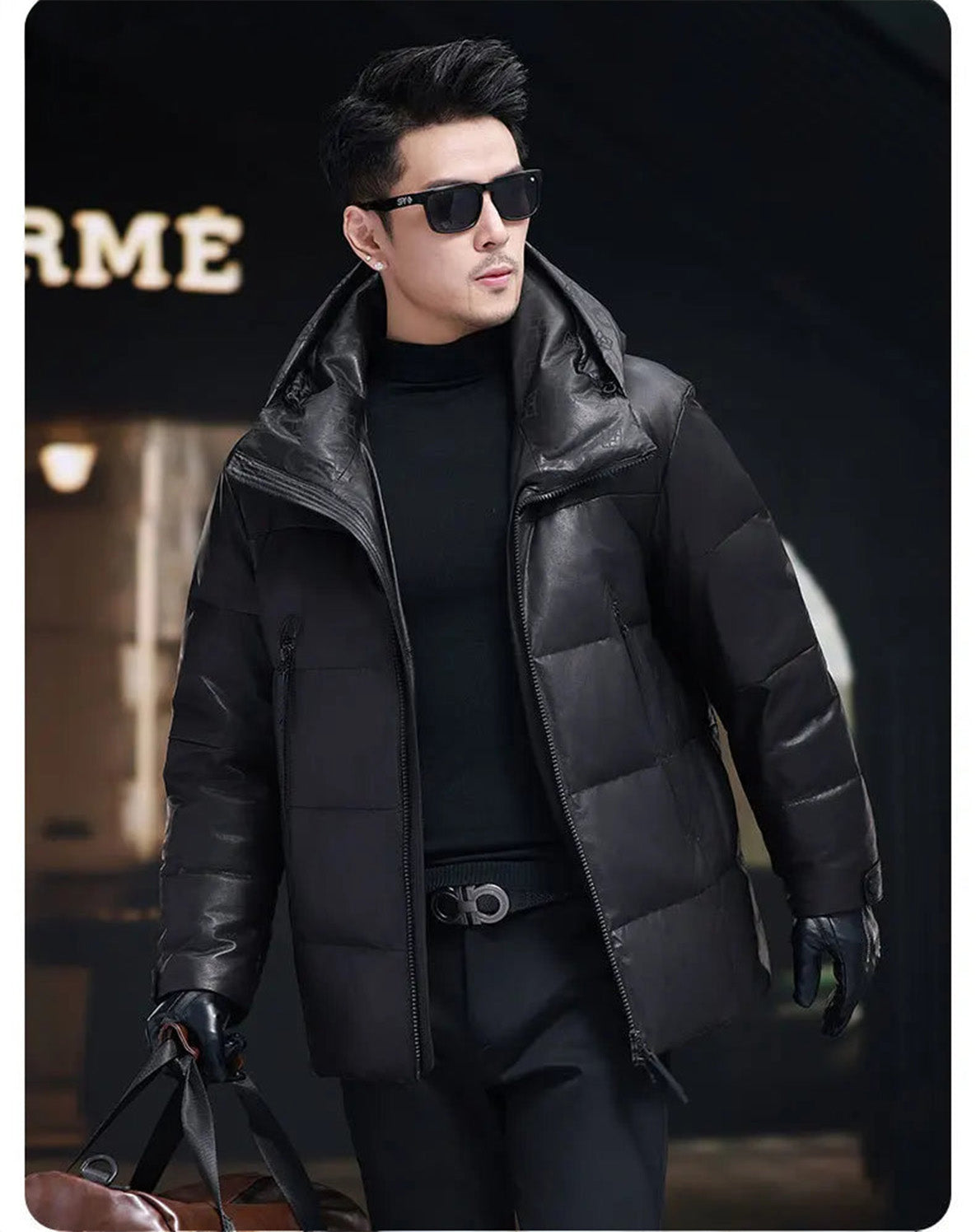 Model wearing the jacket while holding an oversized bag, highlighting the clean silhouette and practical volume — From Borcelleclothes.