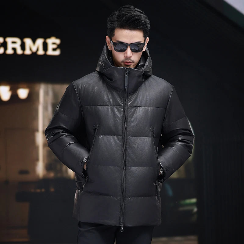 Men’s sheepskin down jacket in Onyx with large diagonally zippered pockets, exposed central closure, sculptural hood, and tonal imprint under the collar — From Borcelleclothes.