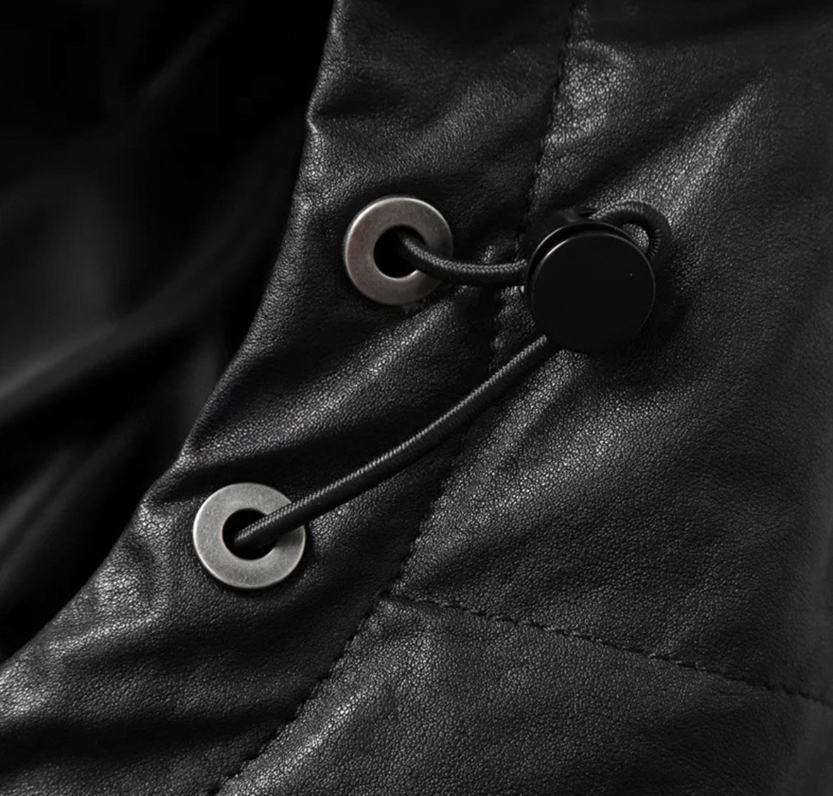 Close-up of drawstring cord locks on Black Magic sheepskin jacket – From Borcelleclothes.