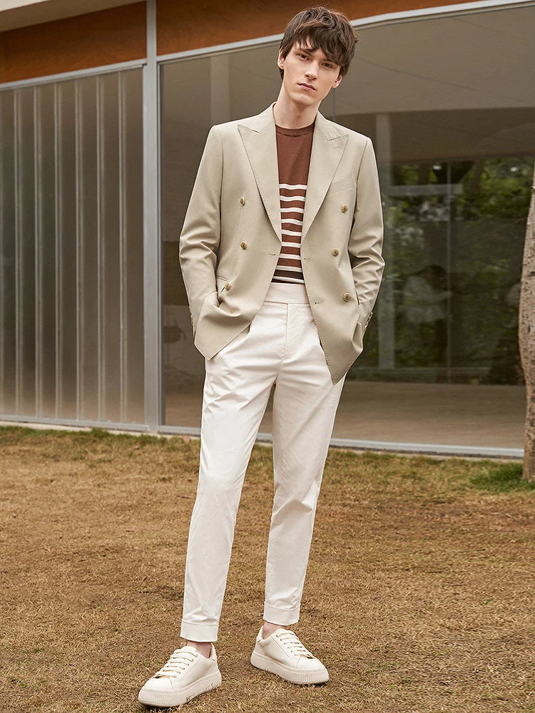 Model stepping forward in the Soft Amber suit, capturing fluid movement within a tailored frame. From Borcelleclothes.