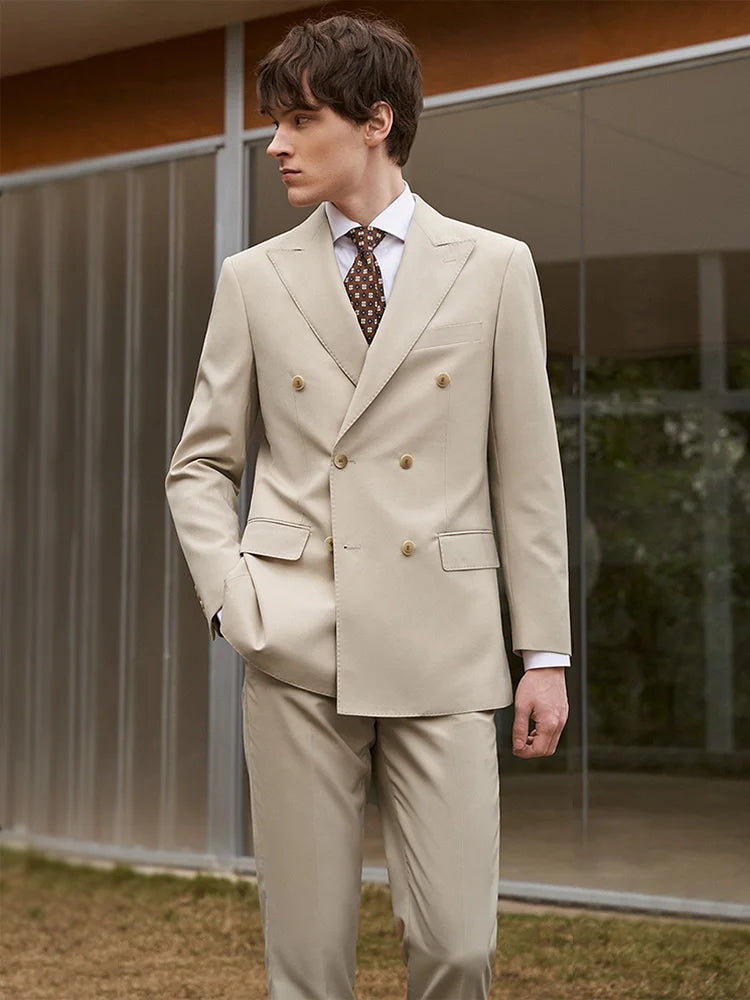 Model in Soft Amber suit looking to the side, showcasing the peaked lapels and composed silhouette. From Borcelleclothes.