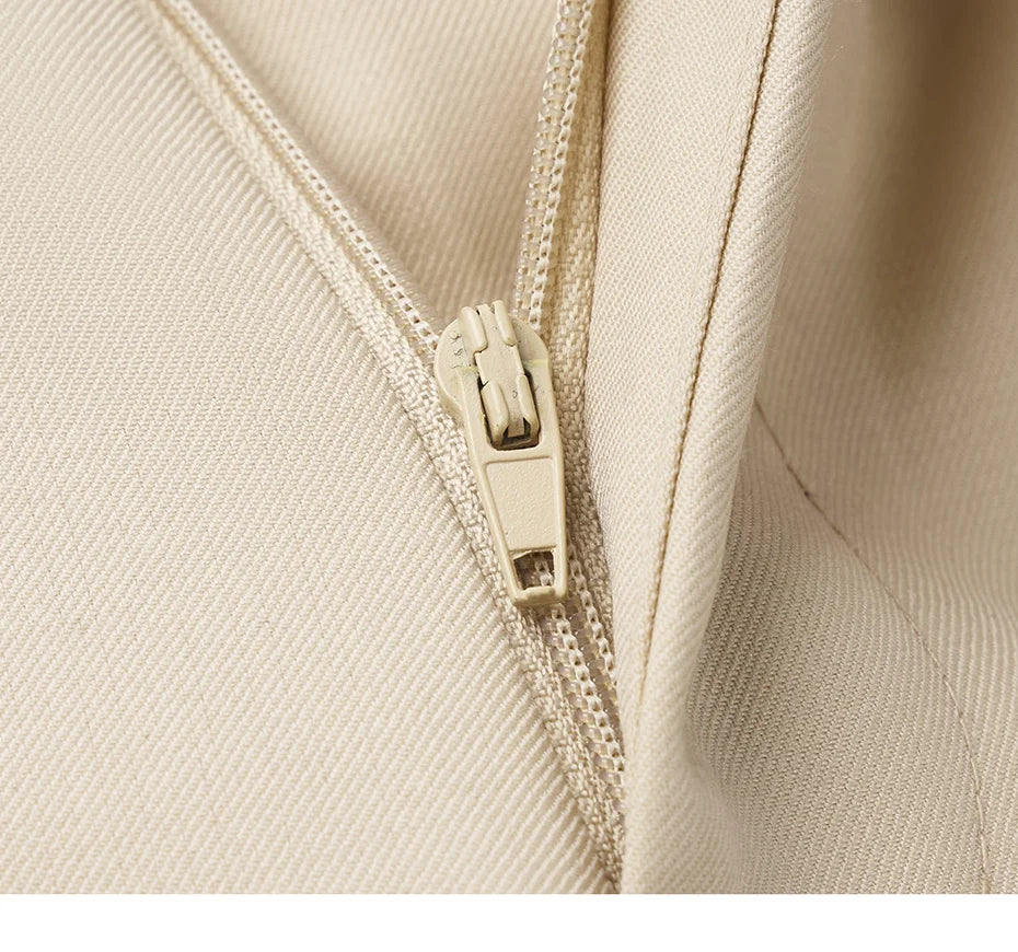 Close-up of the unzipped fly on the Soft Amber trousers, revealing zipper construction and fabric texture. From Borcelleclothes.
