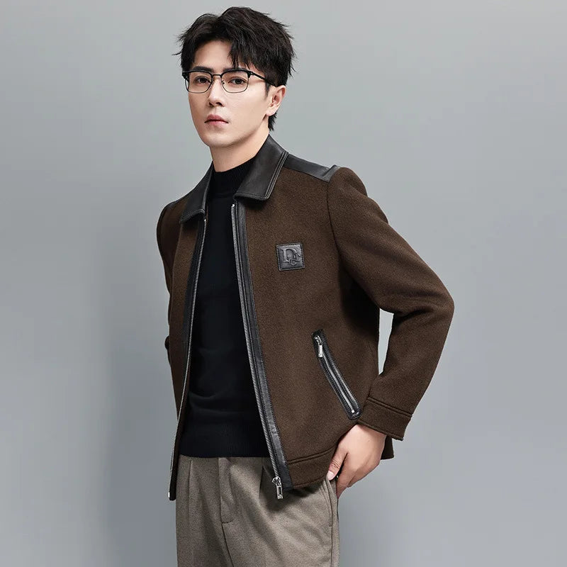 Men’s structured leather-wool jacket in Dark Rum, featuring a leather collar, shoulders, and back with soft wool panels, finished with cuffs and a lower band for a defined silhouette. From Borcelleclothes.
