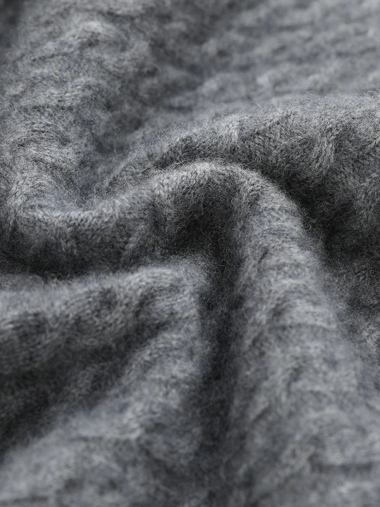 Wave-folded texture showcasing the cable knit and softness of the Davy Grey cashmere sweater — From Borcelleclothes.