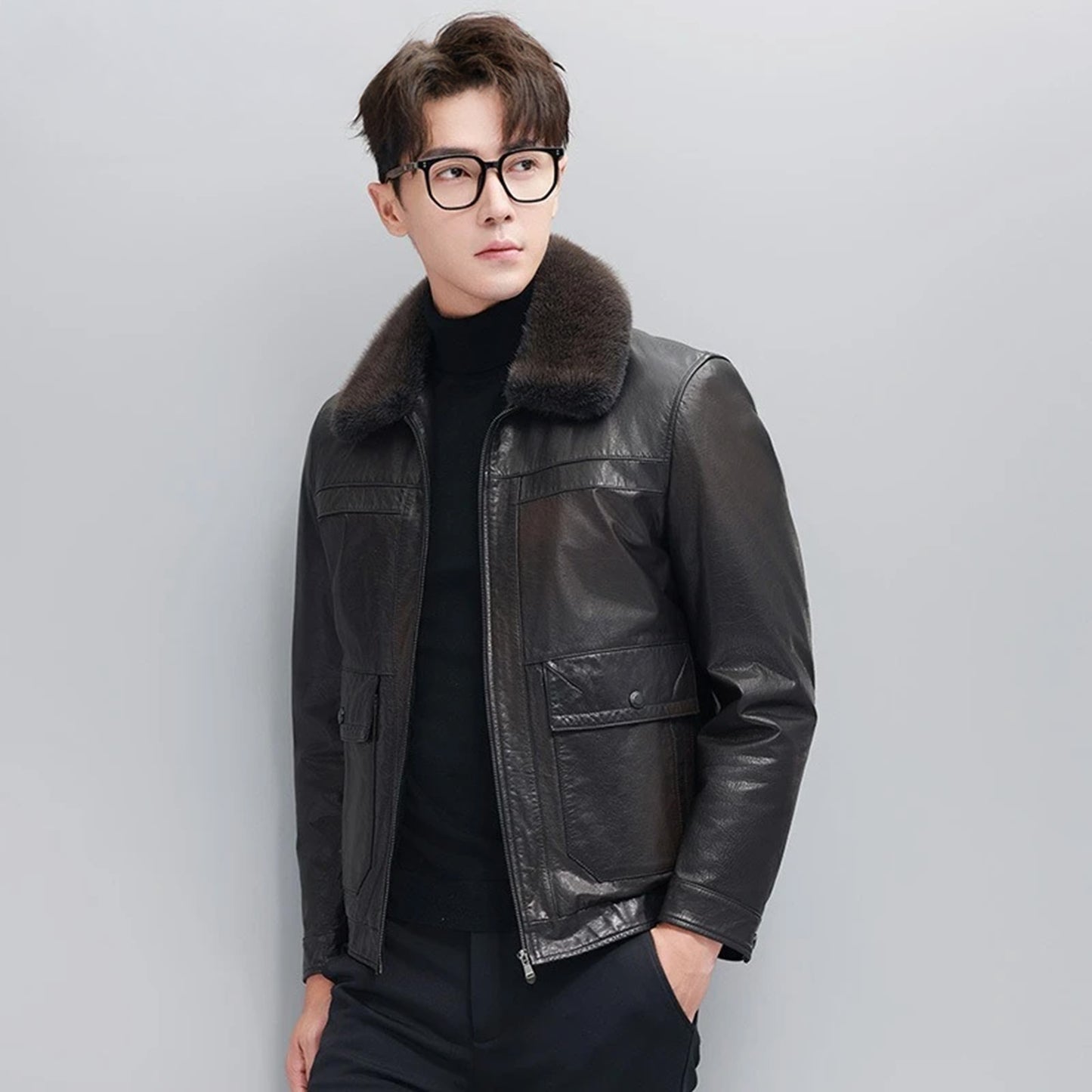 Men’s Wenge leather down jacket, model turned slightly to the side — From Borcelleclothes.