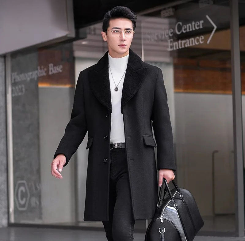 Men’s wool-cashmere coat with shearling peaked lapels in Onyx, straight cut, flap pockets, and down-filled lining for warmth and refined style. From Borcelleclothes.