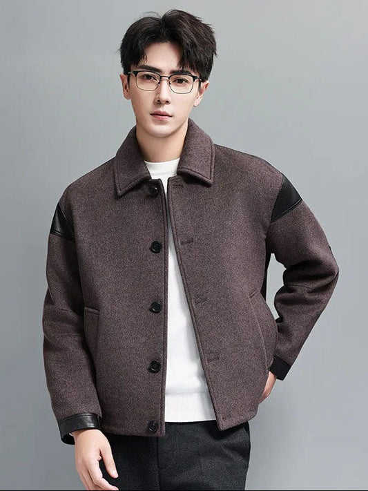 Model with hand behind back wearing men's wool-cashmere jacket with leather traces – From Borcelleclothes.