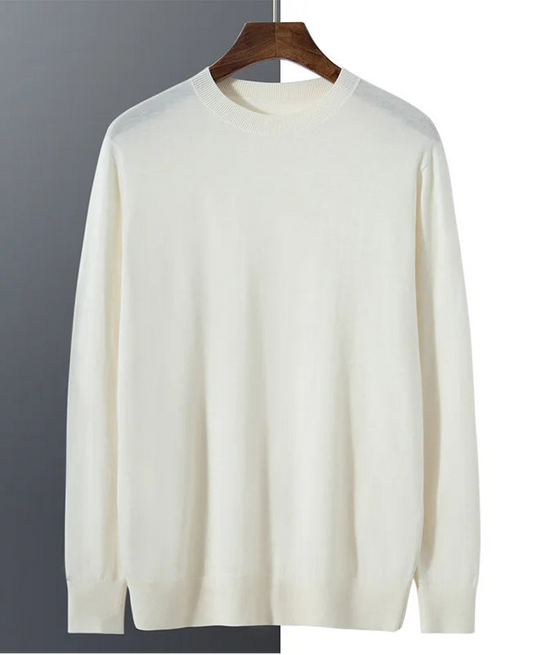Fluid Draping of a regular-fitting worsted cashmere crewneck sweater in Platinum, made of 100% Alashan cashmere with stockinette body, 1×1 ribbed collar, cuffs, and hem — From Borcelleclothes.