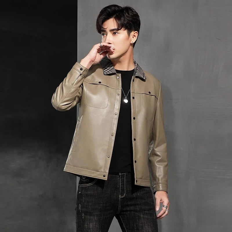 Model turned slightly to the side, touching lips, wearing the woven-collar sheepskin jacket in Shadow — From Borcelleclothes.