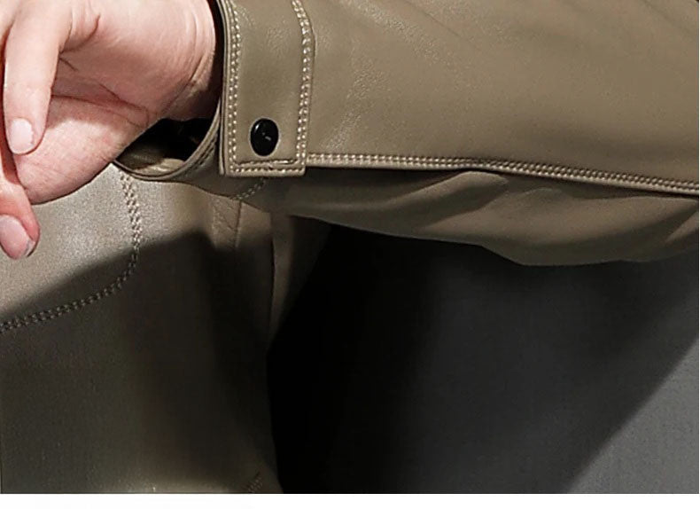 Detail of the snap cuff on the woven-collar sheepskin jacket in Shadow — From Borcelleclothes.