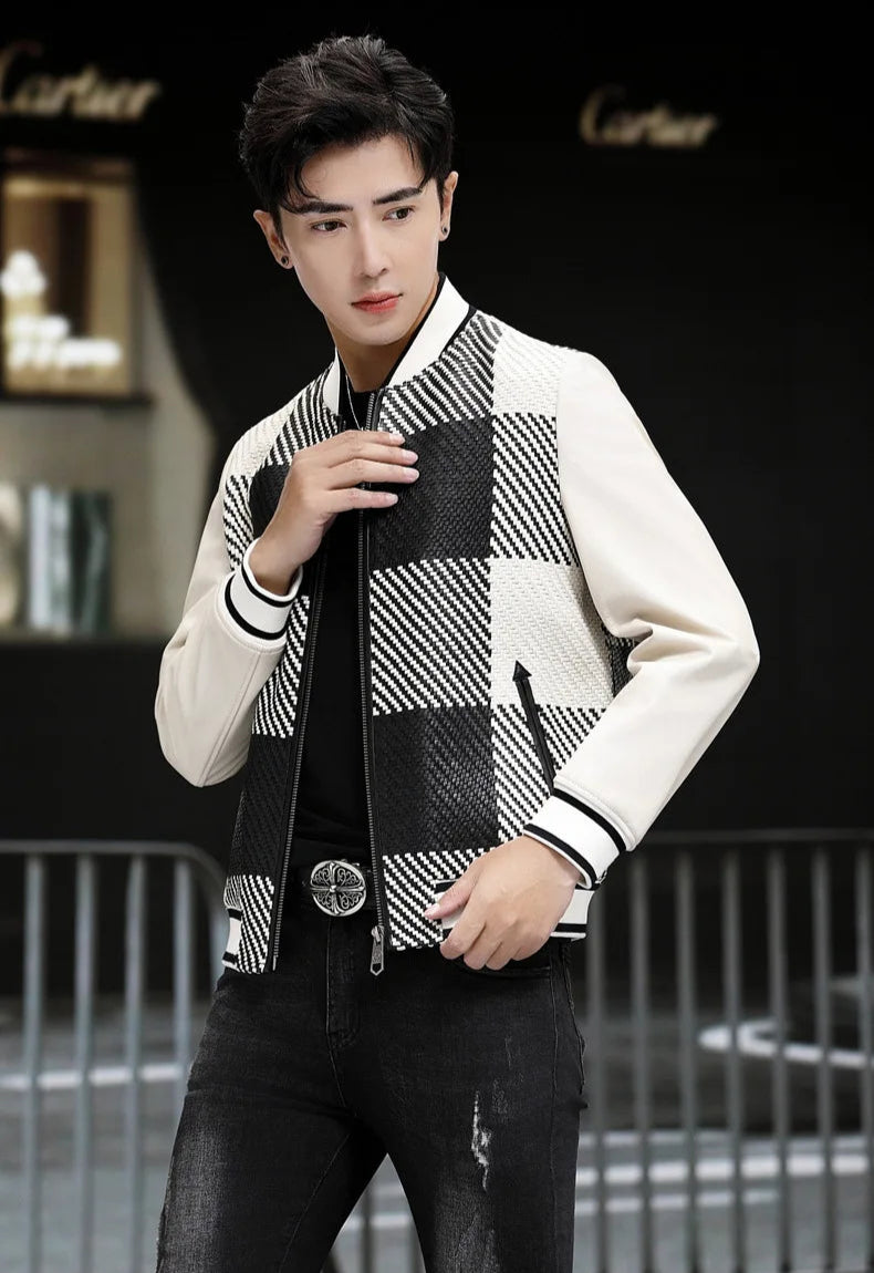 Jacket unzipped; model holding front side; woven-leather plaid panels visible (Platinum & Onyx) — From Borcelleclothes.