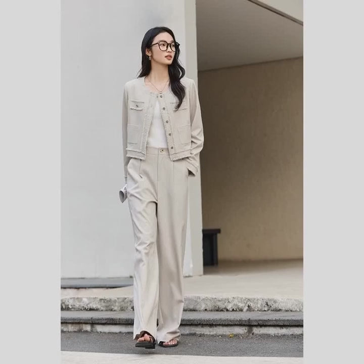 Video showcasing a Women's two-piece set in Martini color with silver buttons and thread-fringed details on the jacket and wide-leg trousers. From Borcelleclothes.