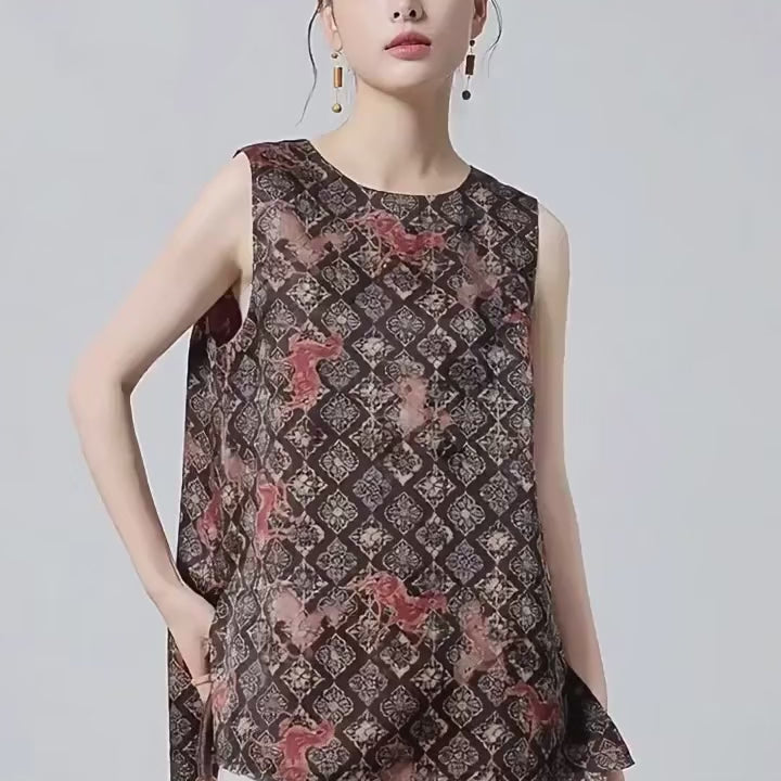 Video showcasing a Women's 100% Mulberry Xiangyunsha silk top in Fire Steeds. Features selective jacquard reliefs, an espresso-and-terracotta finish, and floral rosettes overlaid with fire steeds. — From Borcelleclothes.