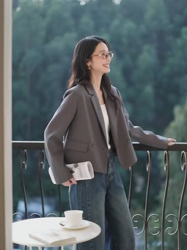 Video showcasing a Women's Davy Grey double-breasted blazer with shortened silhouette, notch lapels, and flap pockets. From Borcelleclothes.