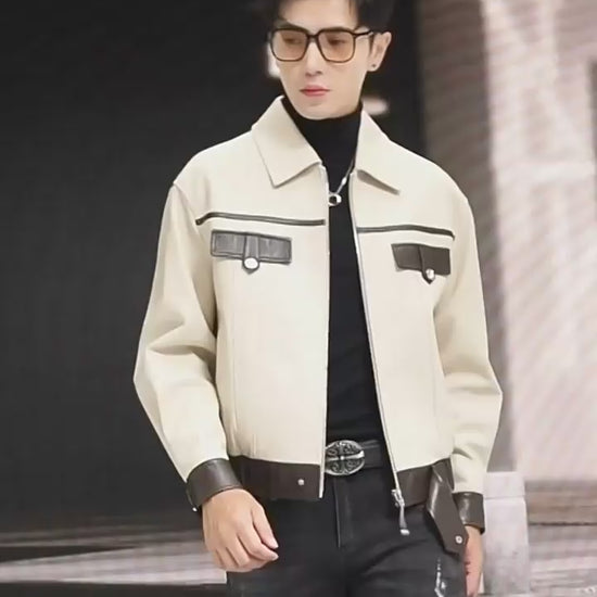 Video showcasing a Men’s sheepskin moto-inspired jacket in Alabaster & Oil, with cropped silhouette, contrast trims, metal accents, and broad collar — From Borcelleclothes.