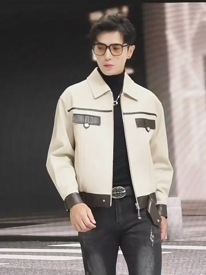 Video showcasing a Men’s sheepskin moto-inspired jacket in Alabaster & Oil, with cropped silhouette, contrast trims, metal accents, and broad collar — From Borcelleclothes.