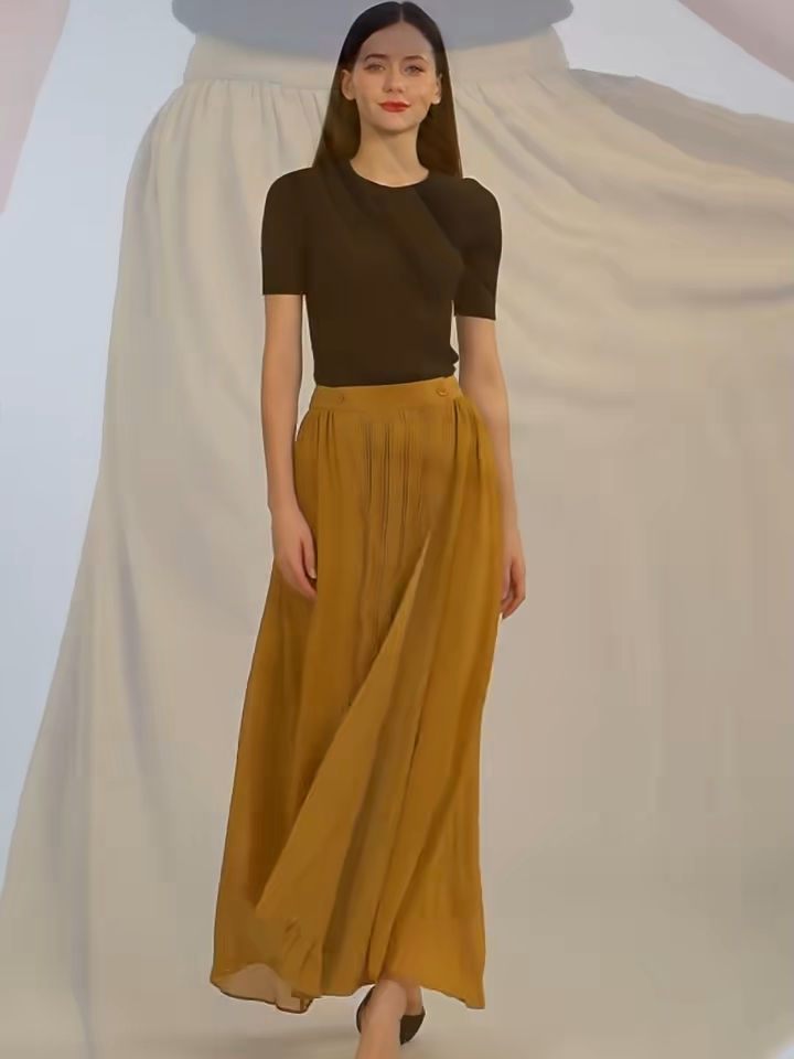 Video showcasing a Women's luxury golden-mustard silk wrap midi skirt with structured panels, delicate pintuck details, and flowing georgette hem. — From Borcelleclothes.