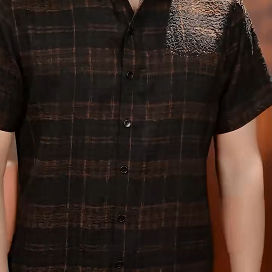 Video showcasing a Men's short-sleeve shirt in Baroque Graphite Xiangyunsha silk, featuring a pointed collar, buttoned placket, matte jacquard relief, and cognac check. — From Borcelleclothes.