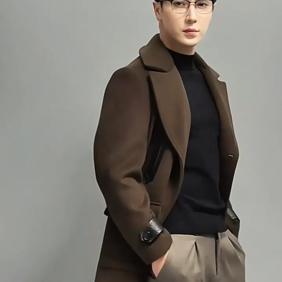 Video showcasing a Men’s double-breasted wool-cashmere coat in Dark Rum, with leather accents and inspired by the classic polo coat. From Borcelleclothes.