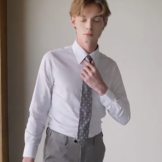 Video showcasing a Men's Lotus White cotton-silk shirt featuring a pointed collar, structured button cuffs, and a reinforced front placket. — Borcelleclothes.