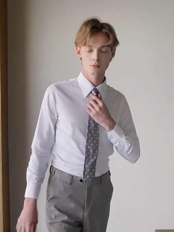 Video showcasing a Men's Lotus White cotton-silk shirt featuring a pointed collar, structured button cuffs, and a reinforced front placket. — Borcelleclothes.
