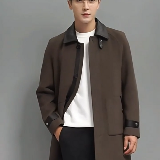 Video showcasing a Men’s Makara wool-cashmere coat with raglan sleeves and leather accents on collar, placket, and cuffs, inspired by the mythical guardian Makara — blending softness and strength. From Borcelleclothes.